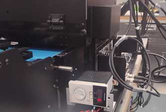 A machine with wires and a boxAI-generated content may be incorrect.