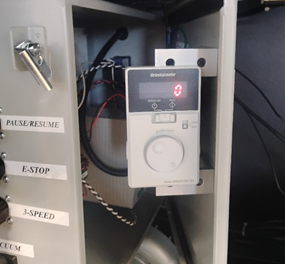 A white electronic device with a key and a round buttonAI-generated content may be incorrect.