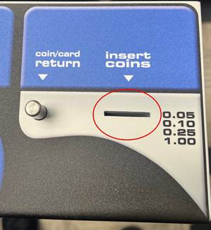 A coin slot with a red circleAI-generated content may be incorrect.