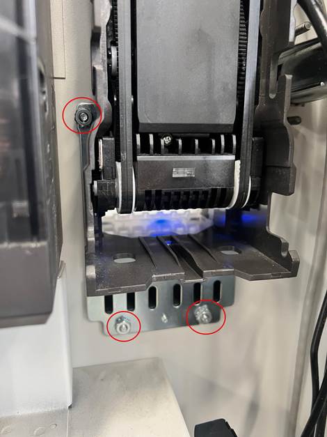 A machine with screws and a black machineAI-generated content may be incorrect.